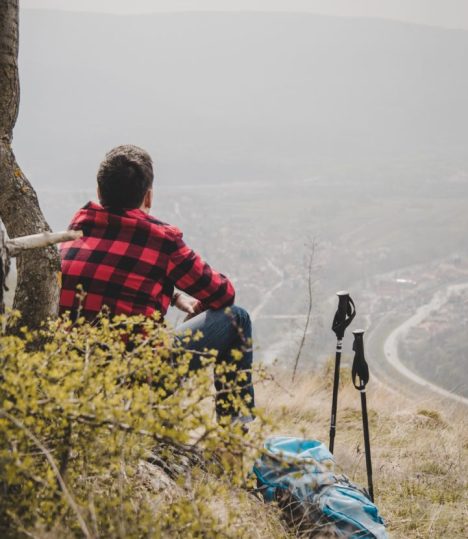 Relaxed hiker whit checkered shirt outdoors